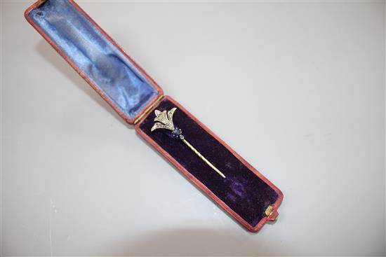 An early 20th century yellow and white metal, sapphire and diamond set stick pin, 62mm, gross weight 2.4 grams.